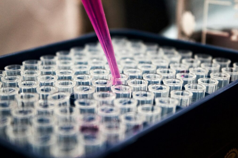 Clinical trial research documents and medical journal articles published on desk representing off-label medical evidence