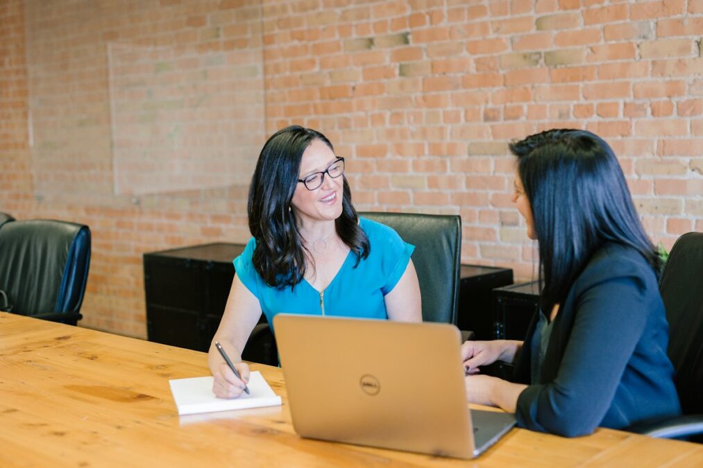 Confident senior woman organizing her medical files and paperwork at a desk, representing financial empowerment