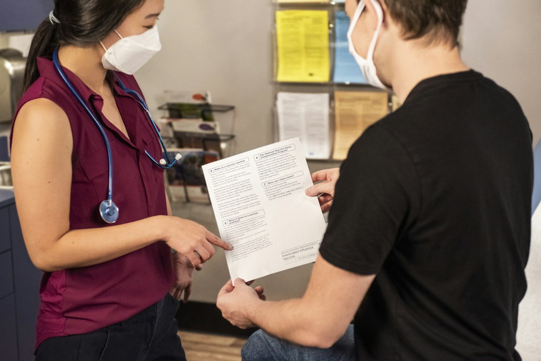 Patient reviewing paperwork after a doctor visit