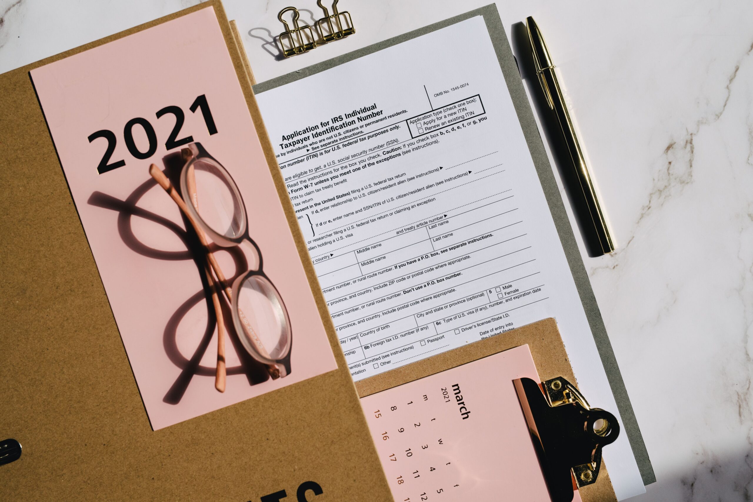 Close-up of printed documents and receipts spread on a desk