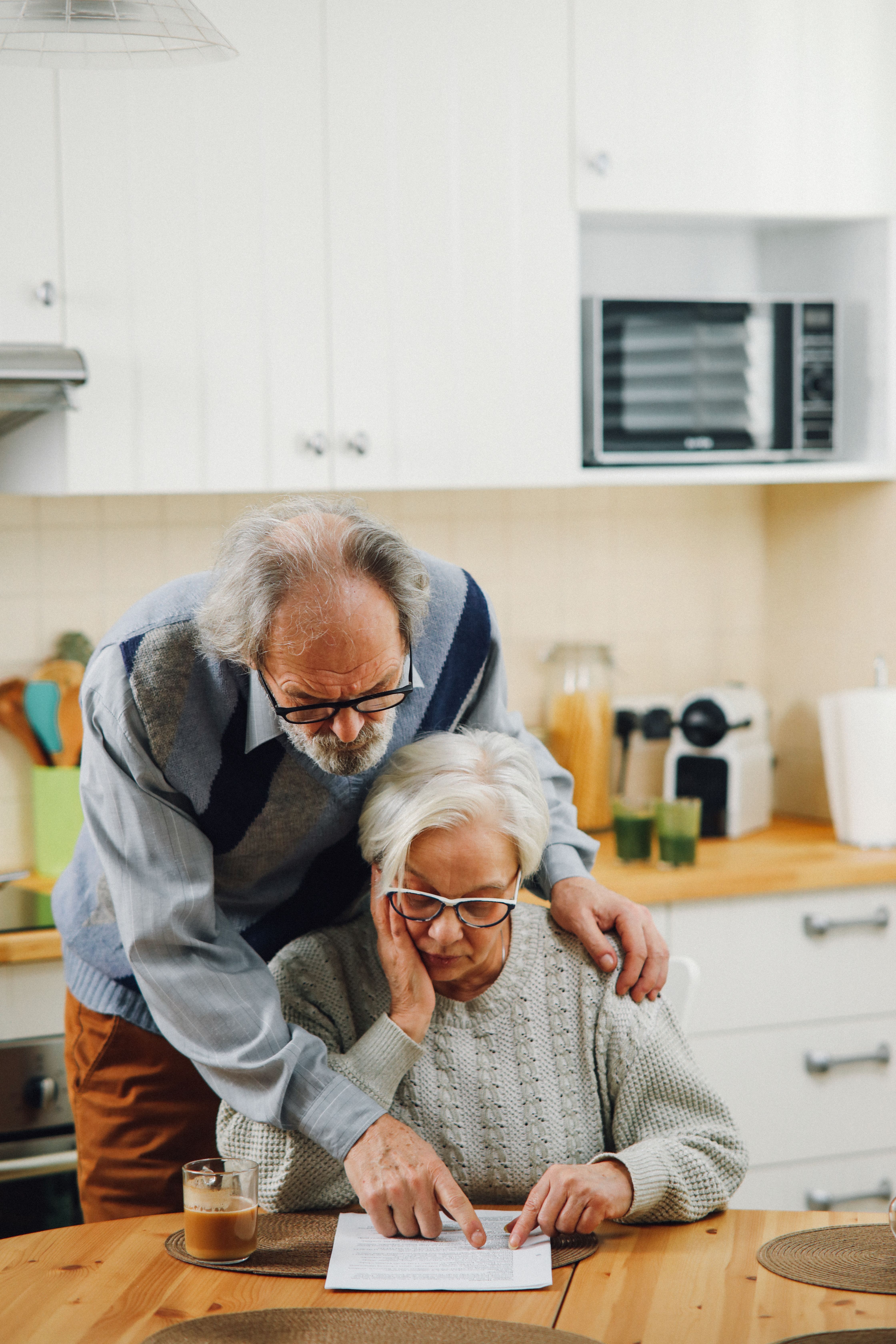Older couple reading through plan documents together